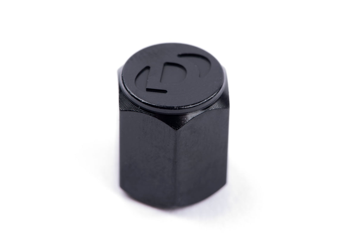 Dinan Valve Stem Caps - Photo - out of package Right