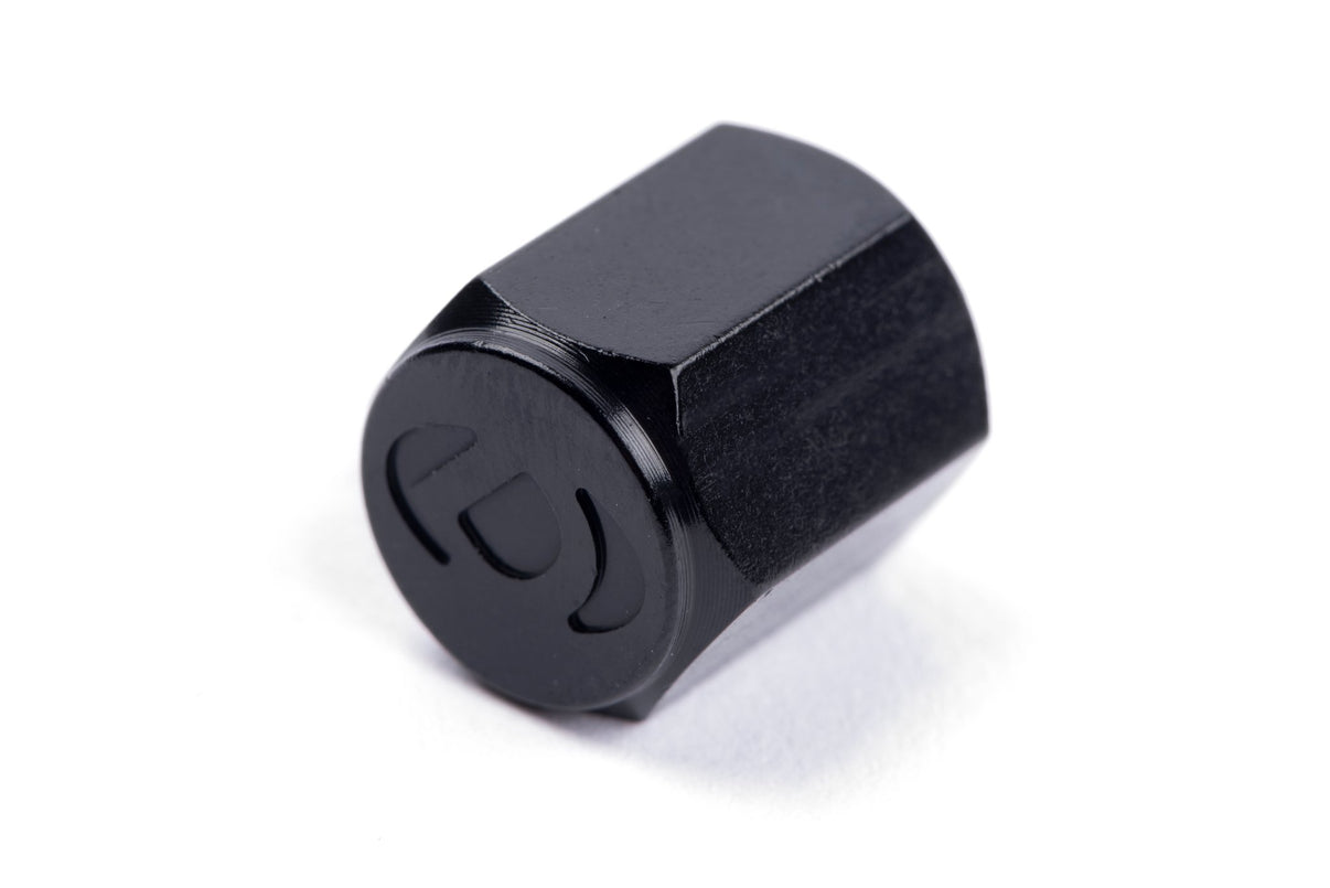 Dinan Valve Stem Caps - Photo - out of package Left