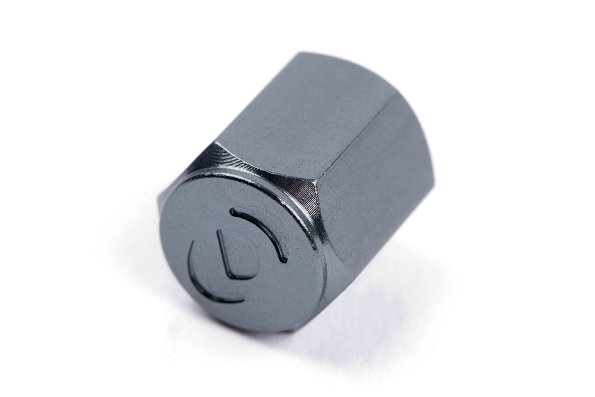 Dinan Valve Stem Caps - Photo - out of package Left